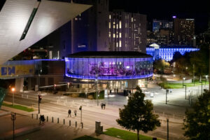 Denver Art Museum’s Sturm Grand Pavilion at night, lit for an evening event — illustrating the real cost of event day-of changes. Photo © Andy Colwell, 2020.