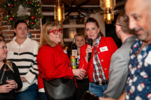 holiday party goers introduce themselves at a denver holiday event.