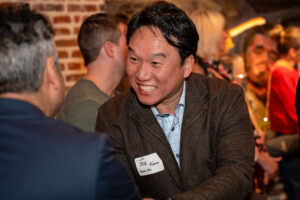 Man networking at a holiday party in denver colorado.