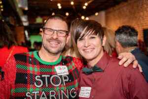 event team posing for a pic at holiday party gather in denver with colorado lighting and event services and howe eventful.
